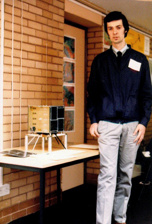 Costas SV1XV during 1988 AMSAT-UK Colloquium next to a mock-up of DOVE DO-17 amateur radio microsat, Photo by SV1RD